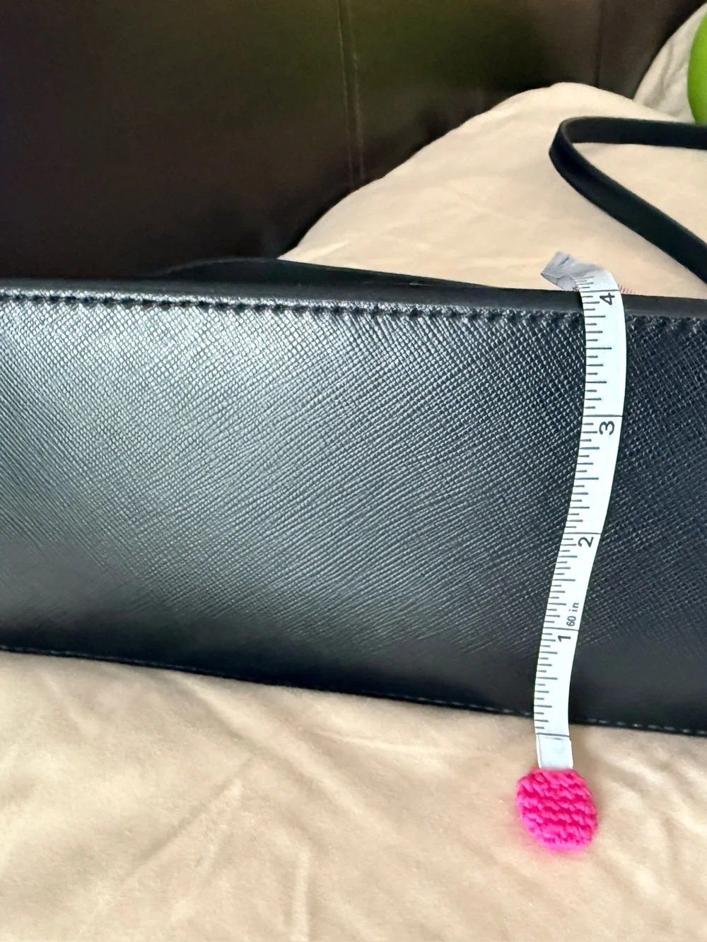 Kate Spade New York Payton Dome Crossbody in black saffiano leather.
